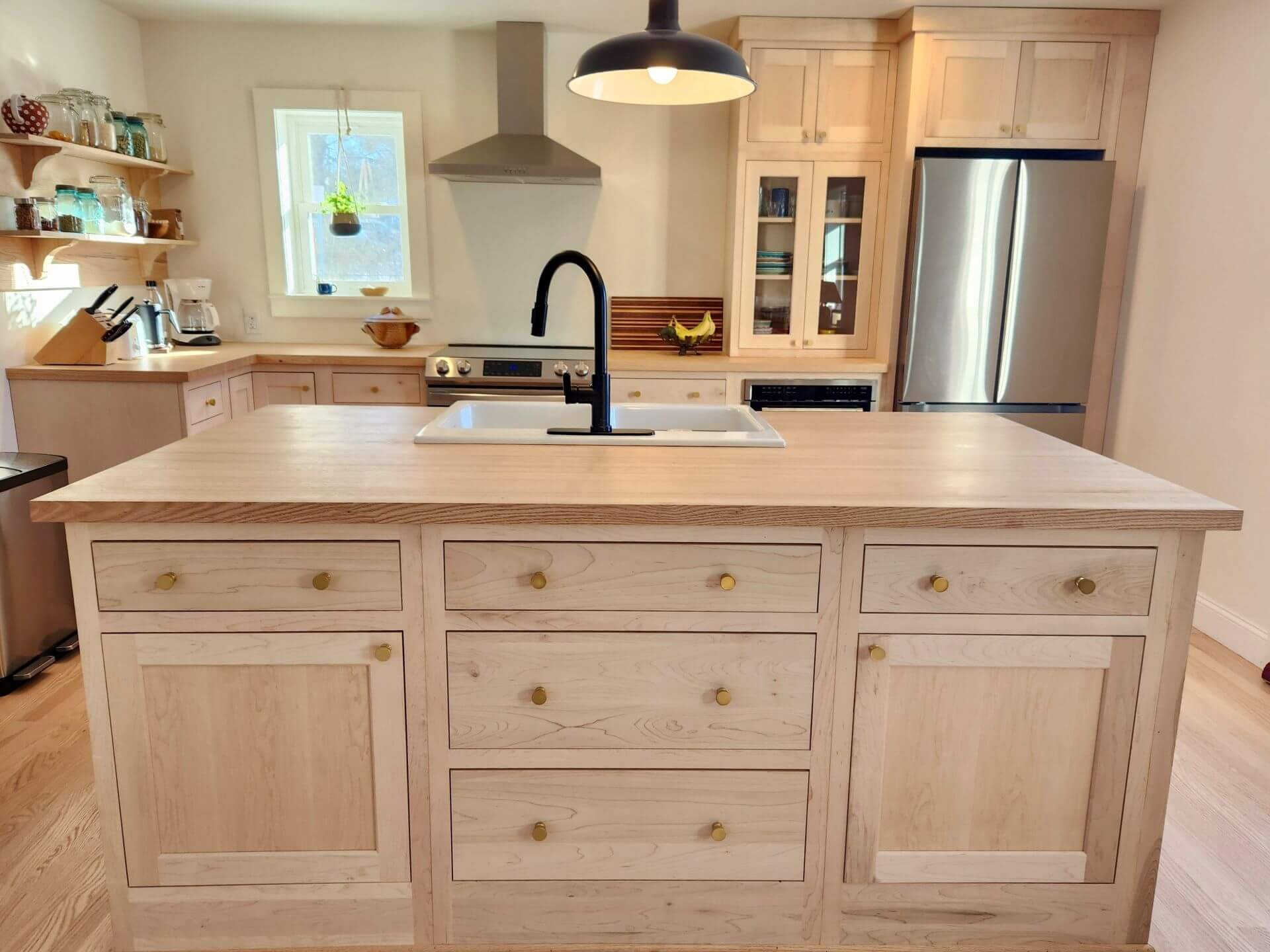 Handcrafted unfinished maple kitchen cabinets in a shaker inset style by UKC.